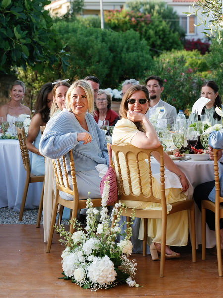 Wedding guests enjoying the al fresco dinner during a destination wedding in Aegina