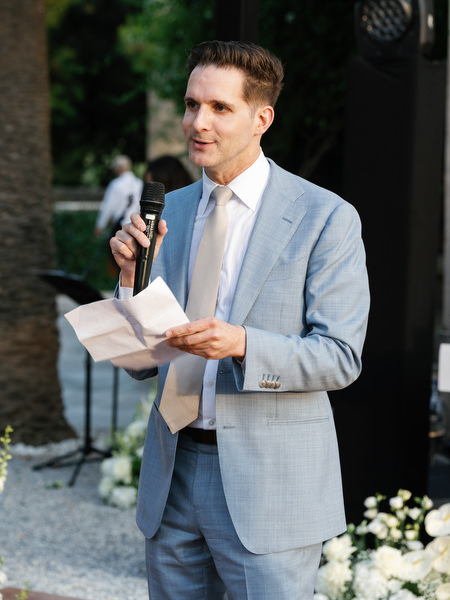 Wedding guest giving a speech during the reception at Pyrgos Ralli