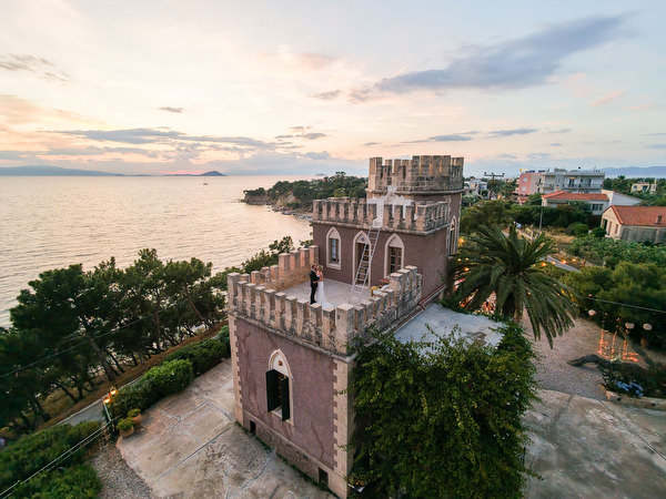 Historic Pyrgos Ralli tower overlooking the sea during Anne and Peter’s Aegina wedding