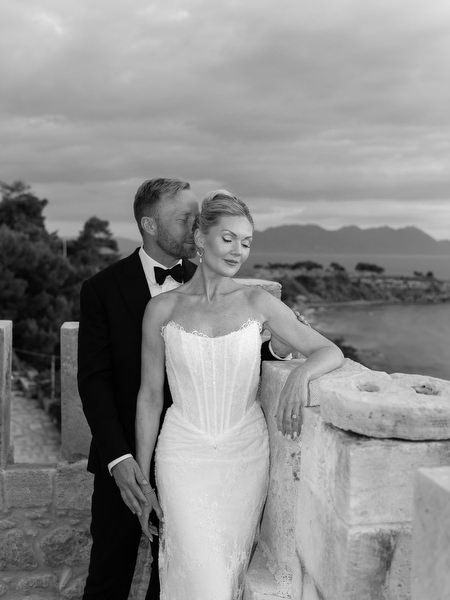 Black and white portrait of the bride and groom on the terrace at Pyrgos Ralli