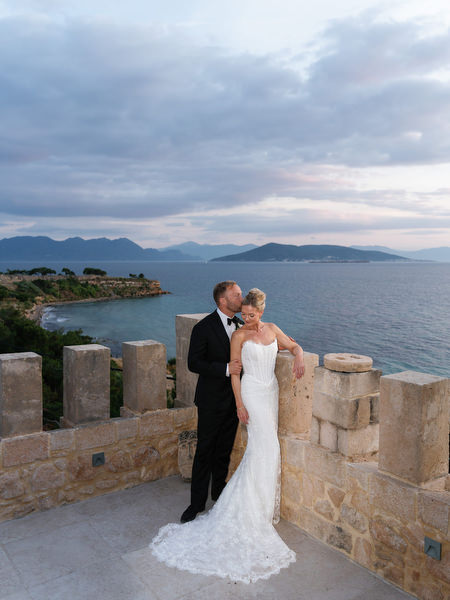 Bride and groom embracing during romantic sunset portraits at Pyrgos Ralli