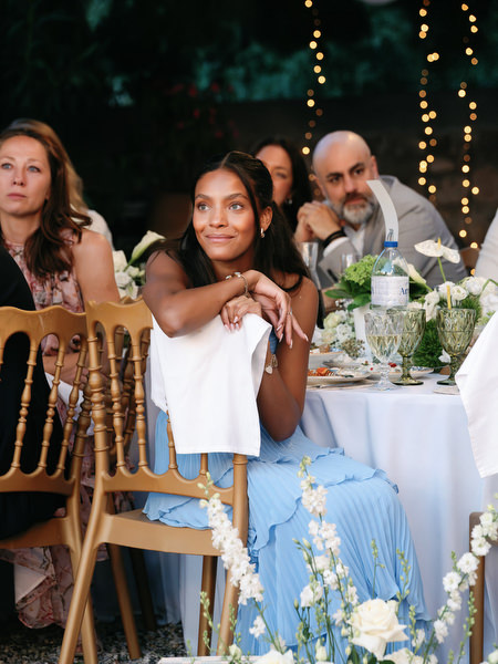 Wedding guest reacting emotionally during speeches at the evening reception