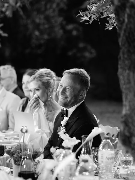 Bride and groom enjoying an emotional moment during the wedding dinner