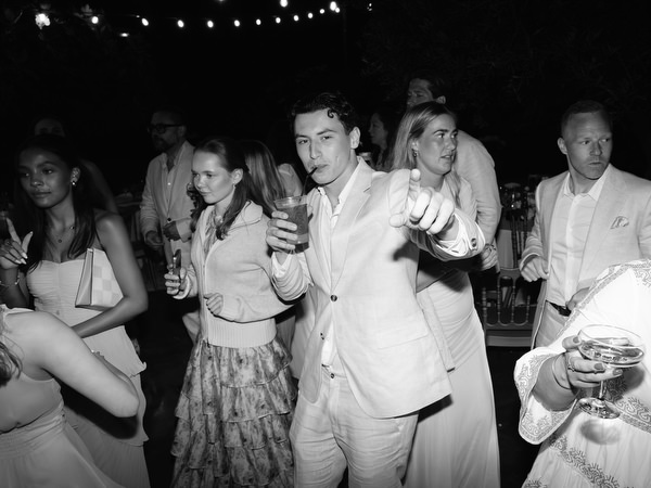 Black and white dance floor moment with wedding guests celebrating at Pyrgos Ralli