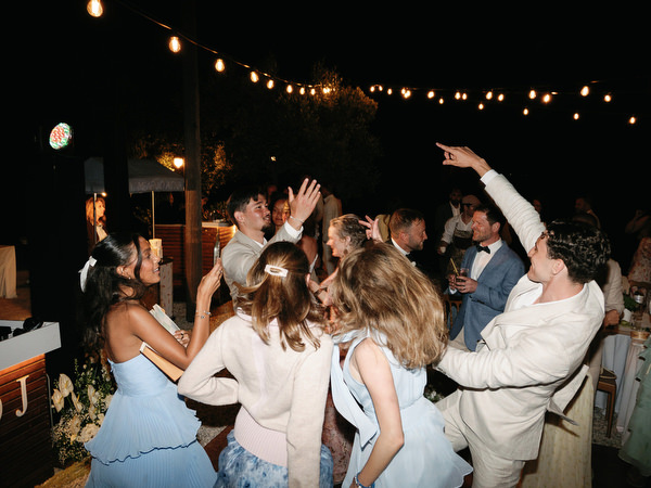 Crowded outdoor dance floor during Anne and Peter’s joyful Pyrgos Ralli wedding party