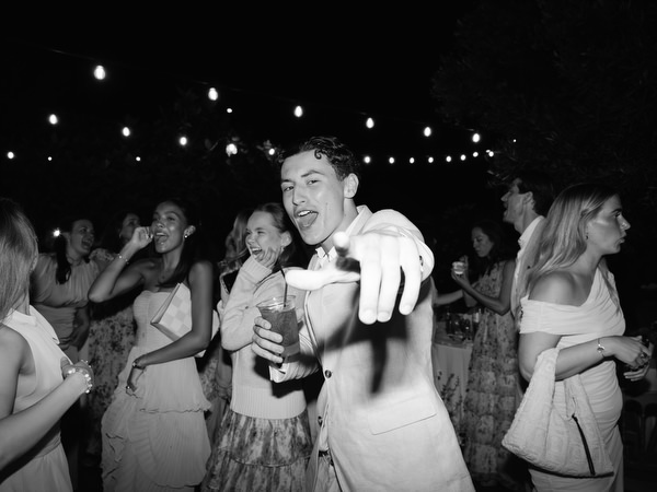 Black and white dance floor moment with guests enjoying the Aegina wedding party