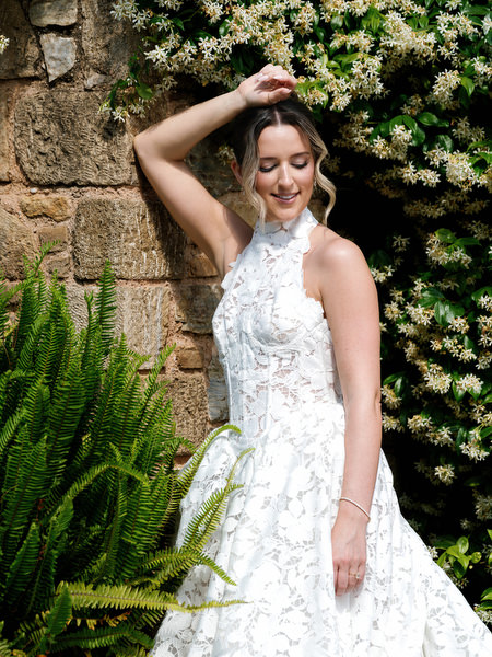 Bride smiling during romantic portraits in the gardens of Pyrgos Petreza