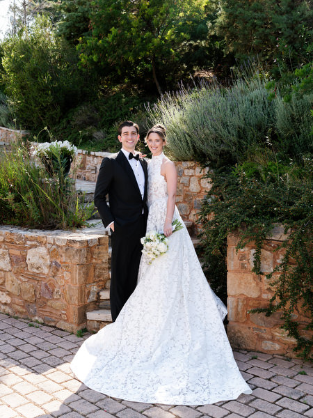 Bride and groom sharing a romantic moment during their first look at Pyrgos Petreza