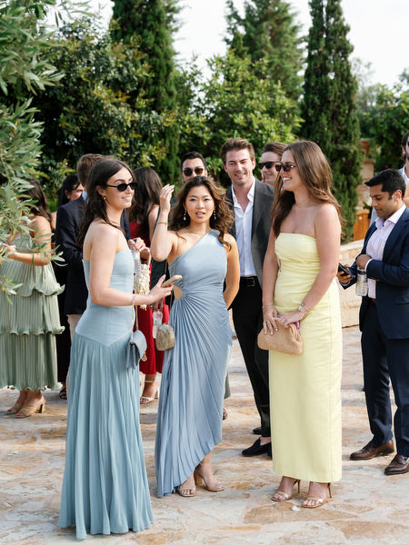 Guests chatting and waiting for the outdoor wedding ceremony to begin