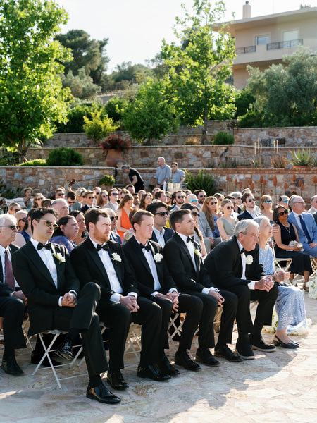 Family members during the emotional outdoor ceremony near Athens