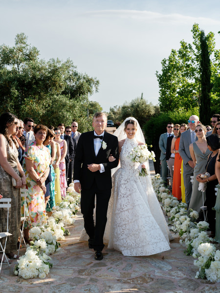 Bride walking down the aisle with her father at Pyrgos Petreza