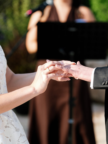 Close-up of the couple exchanging wedding rings during the ceremony