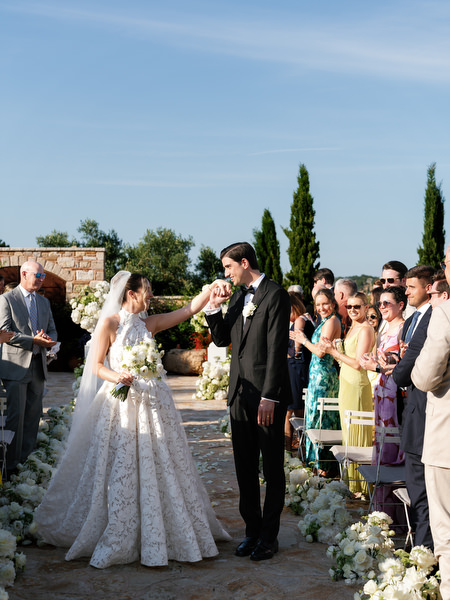 Bride and groom celebrating with guests after their romantic Athens wedding ceremony
