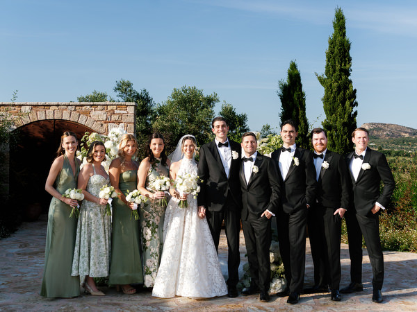 Bride, groom and wedding party posing together after the ceremony at Pyrgos Petreza