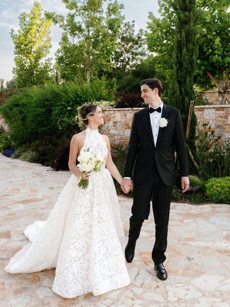 Bride and groom sharing a quiet moment among Mediterranean greenery
