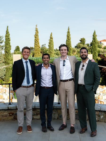 Group of male wedding guests posing together during the reception near Athens