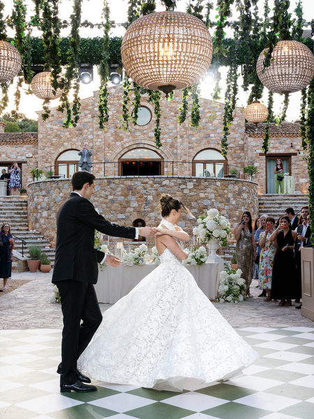 Groom spinning the bride during their first dance at the Pyrgos Petreza reception