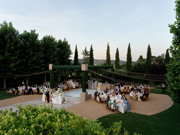 Wide evening view of the Pyrgos Petreza reception surrounded by gardens