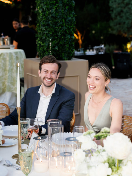 Wedding guests smiling and enjoying the evening reception at Pyrgos Petreza