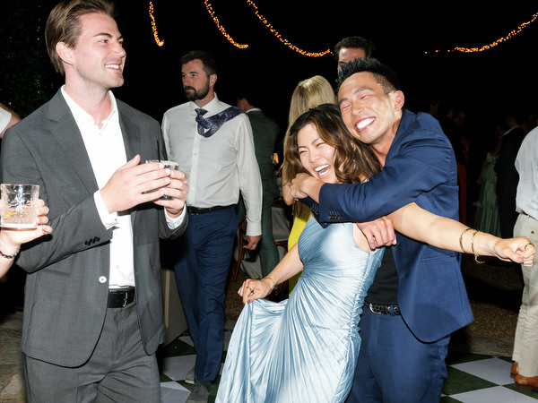 Guests smiling and dancing together during Kristen and Steven’s wedding party
