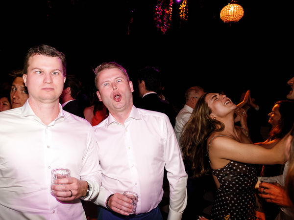 Two wedding guests singing and celebrating during the party near Athens