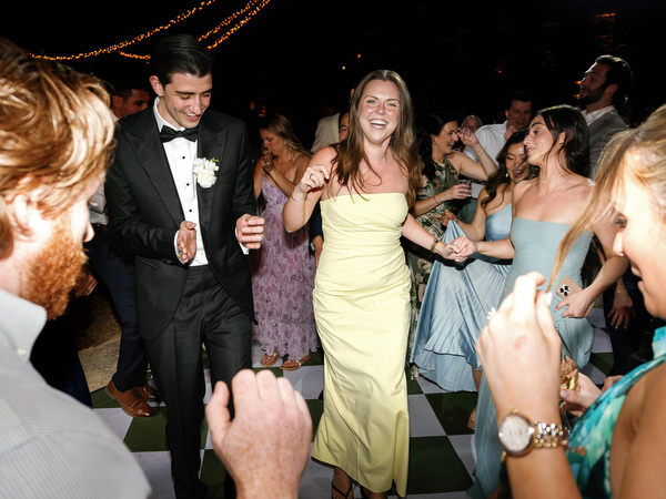 Bride and guests dancing together during the Pyrgos Petreza wedding celebration