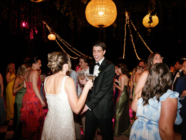 Crowded dance floor with guests celebrating at the Pyrgos Petreza wedding