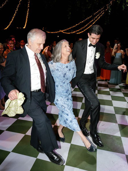 Guests dancing on the patterned floor during the final evening celebration